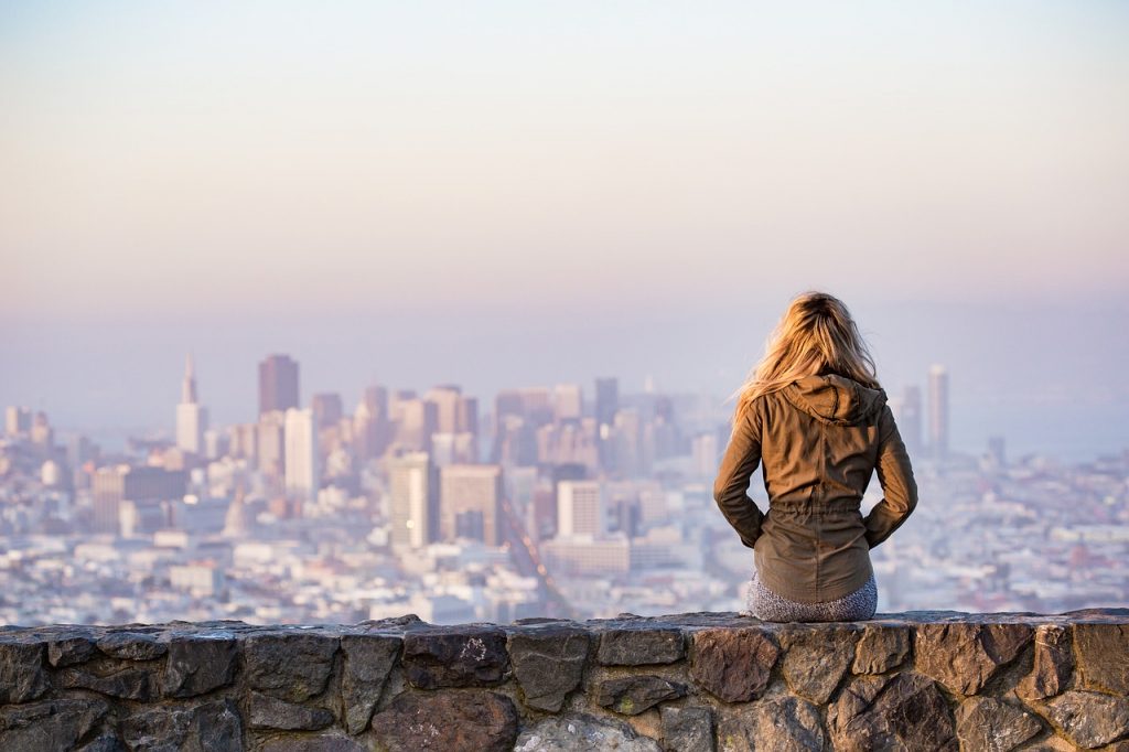Person looking at a large city.